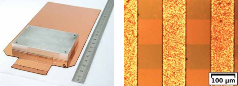FPGA-Array mit mehr als 200 FPGAs; die Größe wird veranschaulicht durch mikroskopische Darstellung und Lineal, das neben dem FPGA-Array liegt